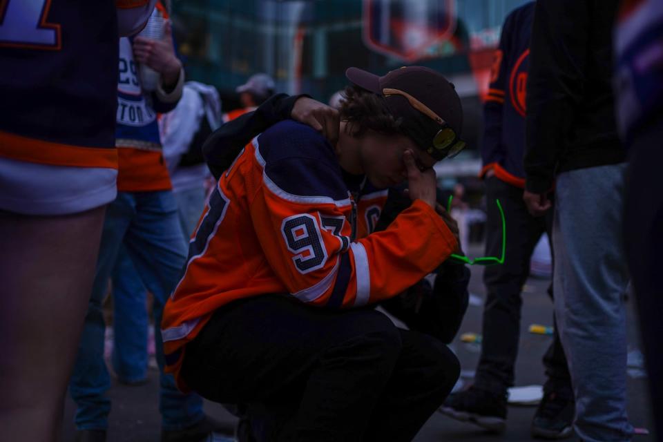 An Edmonton Oilers fan kneels in the Ice District following the team’s 2-1 loss against the Florida Panthers in Game 7 on Monday, June 24, 2024.
