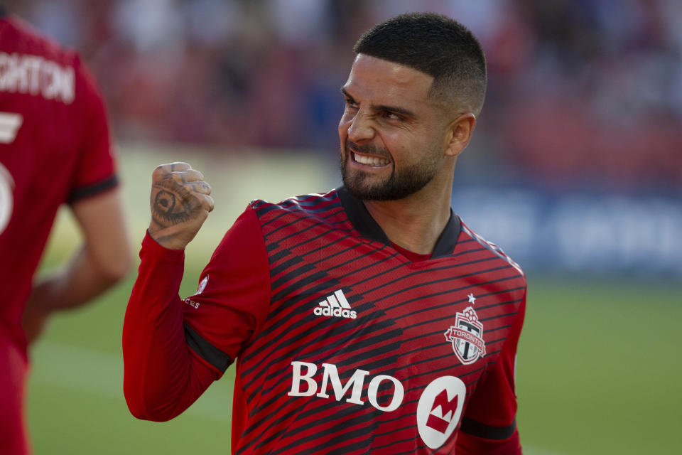 Toronto FC's Lorenzo Insigne celebrates after Michael Bradley scored against Charlotte FC during the first half of an MLS soccer match Saturday, July 23, 2022, in Toronto. (Chris Young/The Canadian Press via AP)