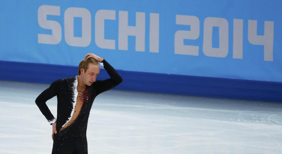 Russia's Evgeny Plyushchenko withdraws during the Figure Skating Men's Short Program at the Sochi 2014 Winter Olympics