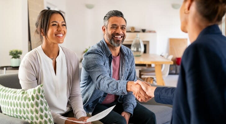 Couple talks to an annuity saleswoman