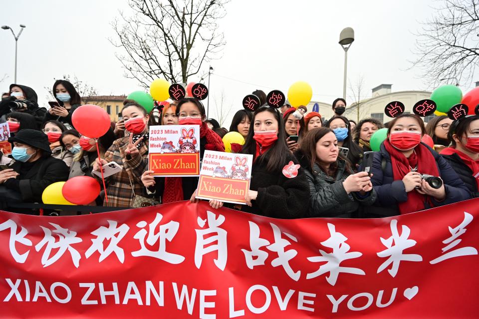 Fans of Xiao Zhan wait for his arrival at Tod's fall 2023 show. 