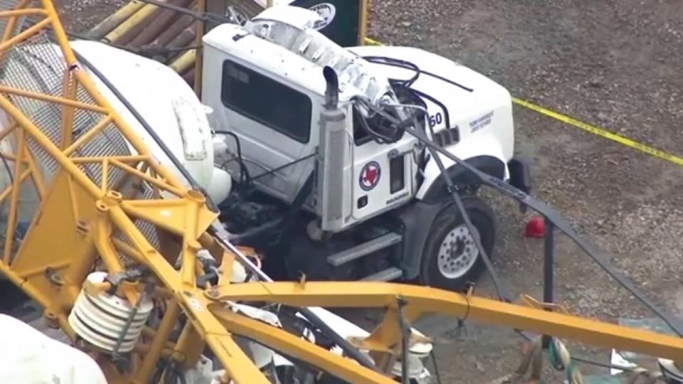 Crane falls, damages industrial truck