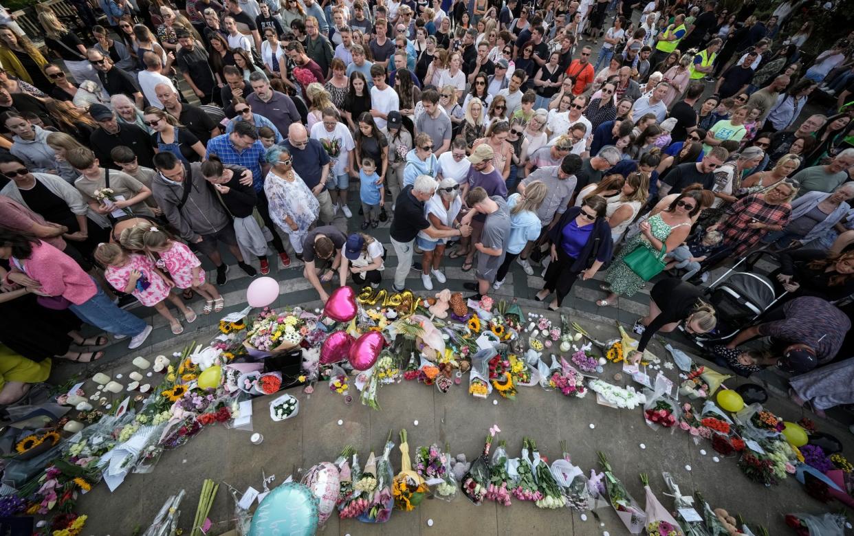 Thousands gather in central Southport to attend a vigil for the child victims of a knife attack