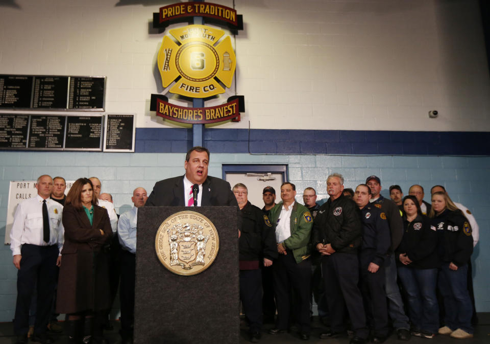 New Jersey Gov. Chris Christie, center, talks during a news conference at at fire house, Monday, Nov. 26, 2012, in Middletown, N.J. Christie announced he will seek re-election to a second term. Christie says he want New Jerseyans to know that he's "in this for the long haul" as he leads the state's recovery from Superstorm Sandy. (AP Photo/Julio Cortez)