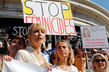 French actor Julie Gayet attends with families of victims and activists a rally against "femicide", gender-based violence targeted at women, in Paris