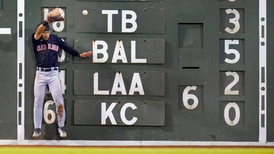 Guardians left fielder Steven Kwan slams into the wall attempting to catch a double by Boston Red Sox shortstop Xander Bogaerts in the eighth inning of Tuesday night's game at Fenway Park. The Guardians won 8-3. [Charles Krupa/Associated Press]