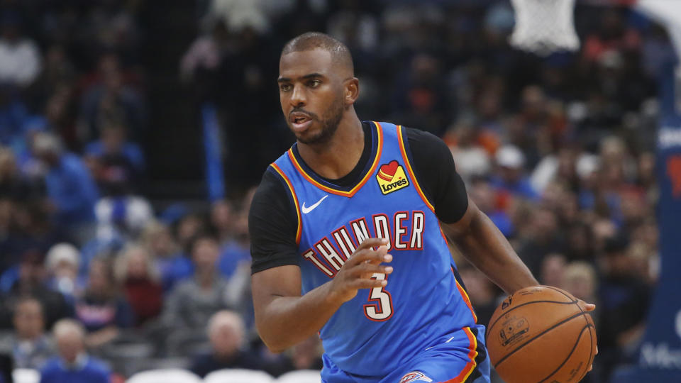 Chris Paul has a new uniform at the Toyota Center. (Sue Ogrocki/AP)