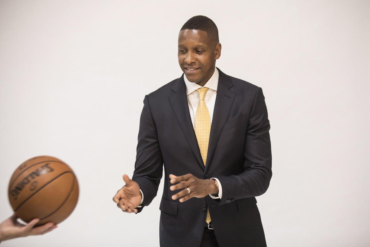 Toronto Raptors president Masai Ujiri is passed a ball for a photo shoot during media day in Toronto on Sept. 25, 2017. (AP)
