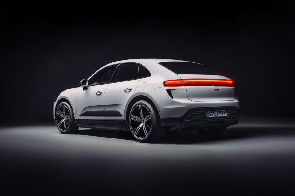 2024 porsche macan ev in pastel colors under a photo studio