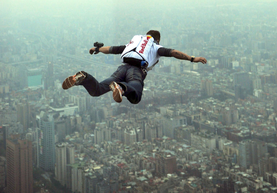 This image provided by the Euro-Newsroom agency shows Austrian base jumper Felix Baumgartner leaping off the Taipei 101 skyscraper in Taiwan Tuesday Dec. 11, 2007. Baumgartner leapt from the 1,676 foot (509 meters) tall building Tuesday after evading security and having to clear a barrier before being able to make his leap. (AP Photo/Joerg Mitter, Euro-Newsroom)
