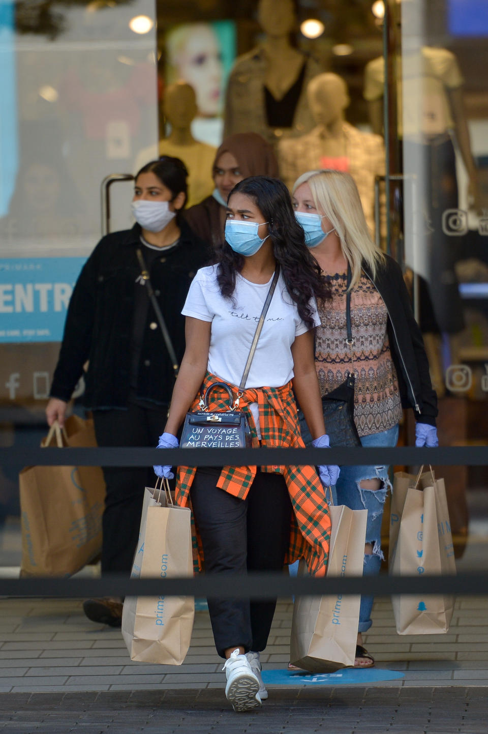 Shoppers leave Primark in Birmingham as non-essential shops in England opened their doors to customers for the first time since the coronavirus lockdown.