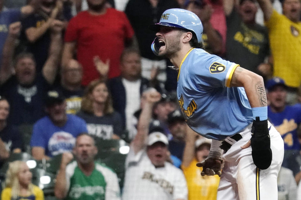 Milwaukee Brewers' Garrett Mitchell reacts after scoring a run during the fifth inning of a baseball game against the New York Yankees Saturday, Sept. 17, 2022, in Milwaukee. (AP Photo/Aaron Gash)