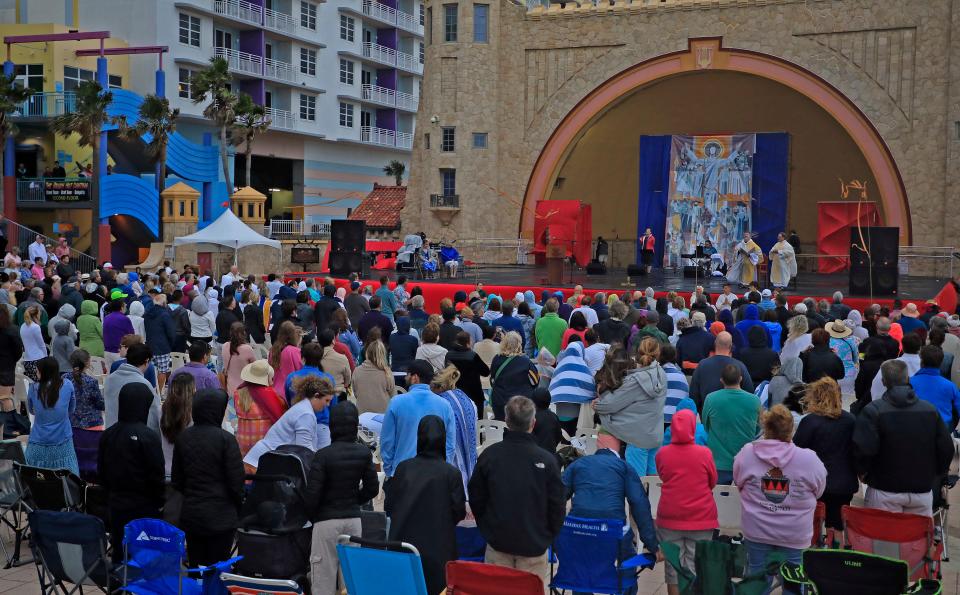 Father Phil Egitto conducts last year's Easter sunrise service at the Daytona Beach Bandshell. Weather is expected to be good for this year's annual sunrise service on at the World's Most Famous Beach.