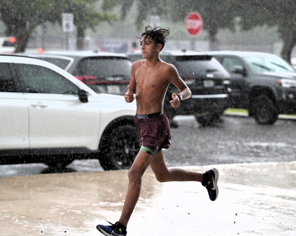 Spanish River's Preston Sangely runs in the rain during a cross country practice on Nov. 14, 2023.