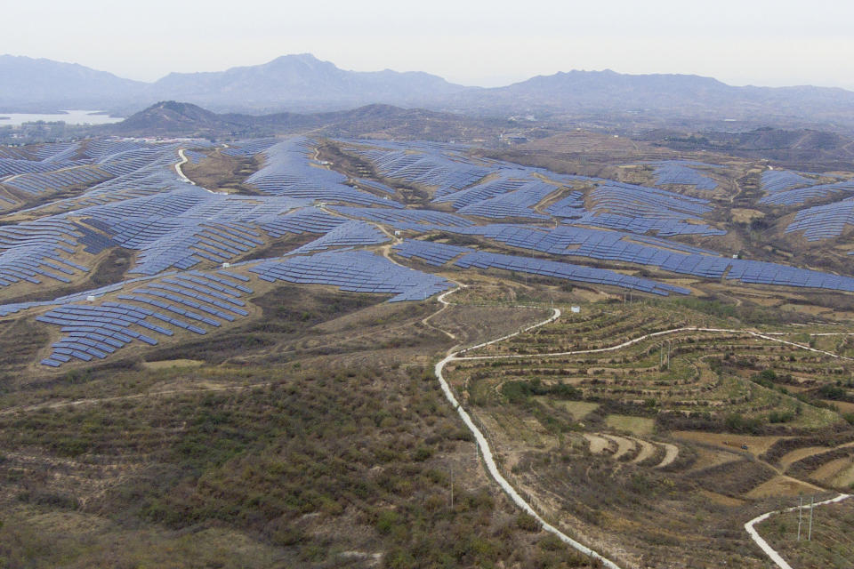 A solar farm is seen next to Donggou village near Shijiazhuang city in the northern China's Hebei province, Friday, Nov. 10, 2023. To meet the goal of limiting global warming to 1.5 degrees Celsius (2.7 degrees Fahrenheit), nine major Asian economies must increase the share of electricity they get from renewable energy from the current 6% to at least 50% by 2030, according to a report by a German thinktank released Wednesday, Nov. 15, 2023. (AP Photo/Ng Han Guan)