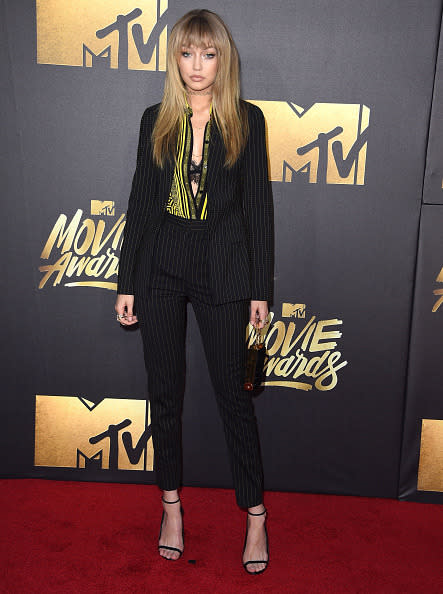 Gigi Hadid in a pin-striped suit and bangs 