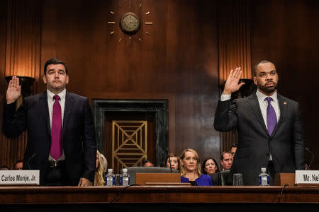 Carlos Monje, Jr., Twitter director of Public Policy and Philanthropy for U.S. & Canada and Facebook policy director Neil Potts sworn in before testifying at Senate Judiciary Constitution Subcommittee hearing titled "Stifling Free Speech: Technological Censorship and the Public Discourse." on Capitol Hill in Washington, U.S., April 10, 2019. REUTERS/Jeenah Moon