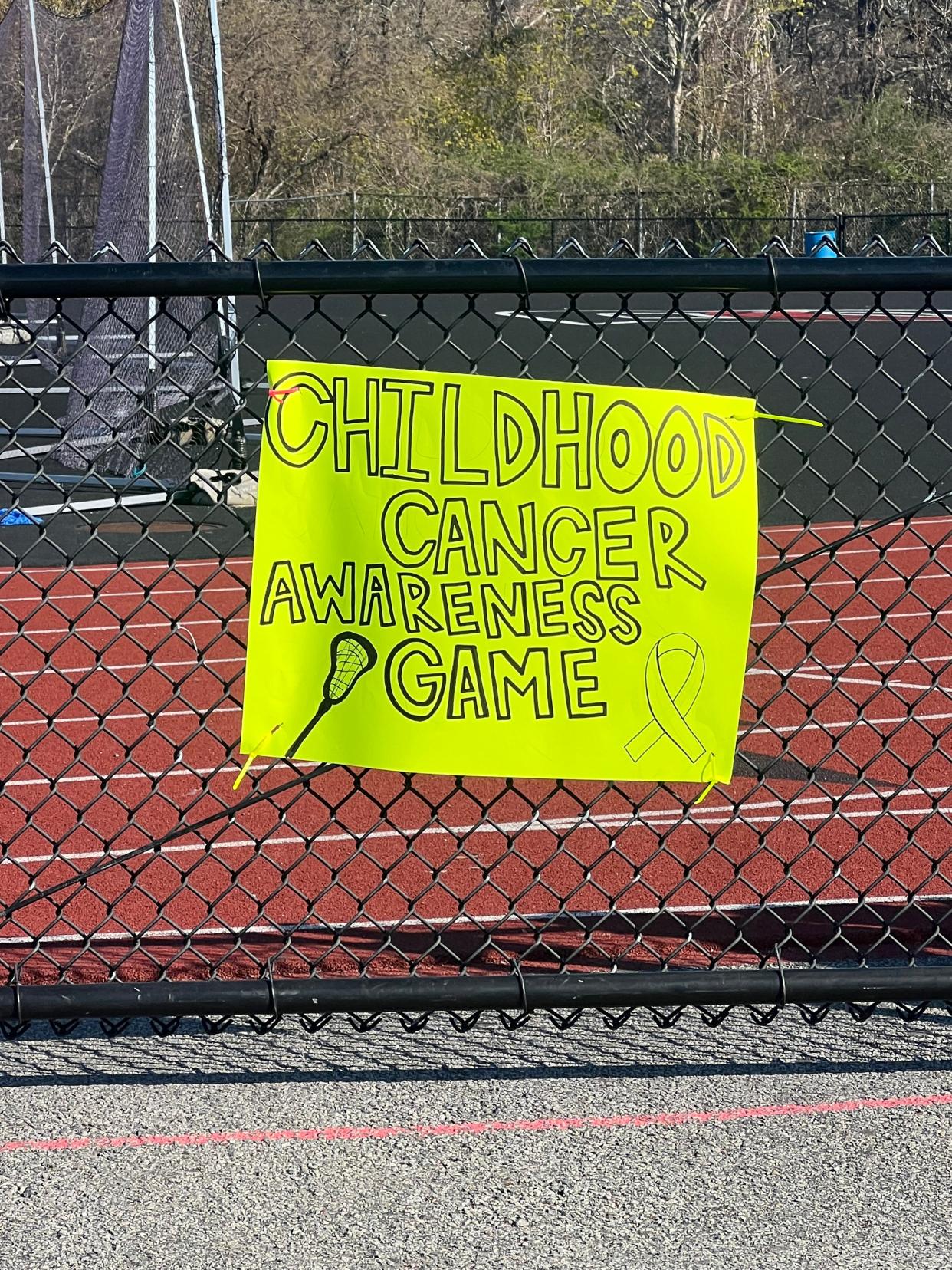 Sign for Barnstable girls lacrosse "Childhood Awareness Game"