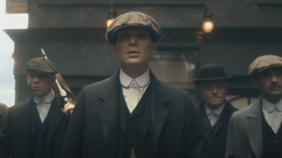 The Peaky Blinders gang ominously walk the street