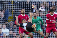 Fulham's Rodrigo Muniz, center, kicks the ball during the English Premier League soccer match between Fulham and Liverpool at Craven Cottage stadium in London, Sunday, April 21, 2024. (AP Photo/Kirsty Wigglesworth)