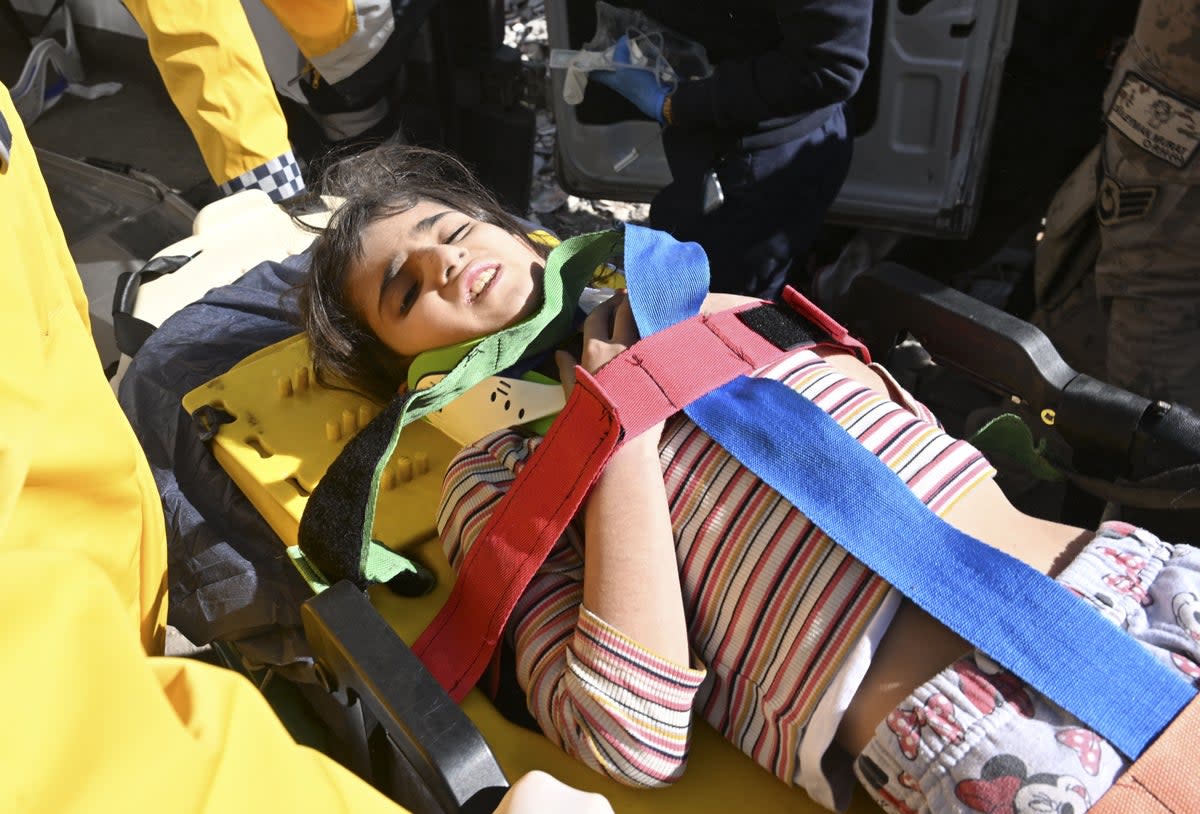 6-year-old Miray is rescued under the rubble of collapsed building (Anadolu Agency via Getty Images)