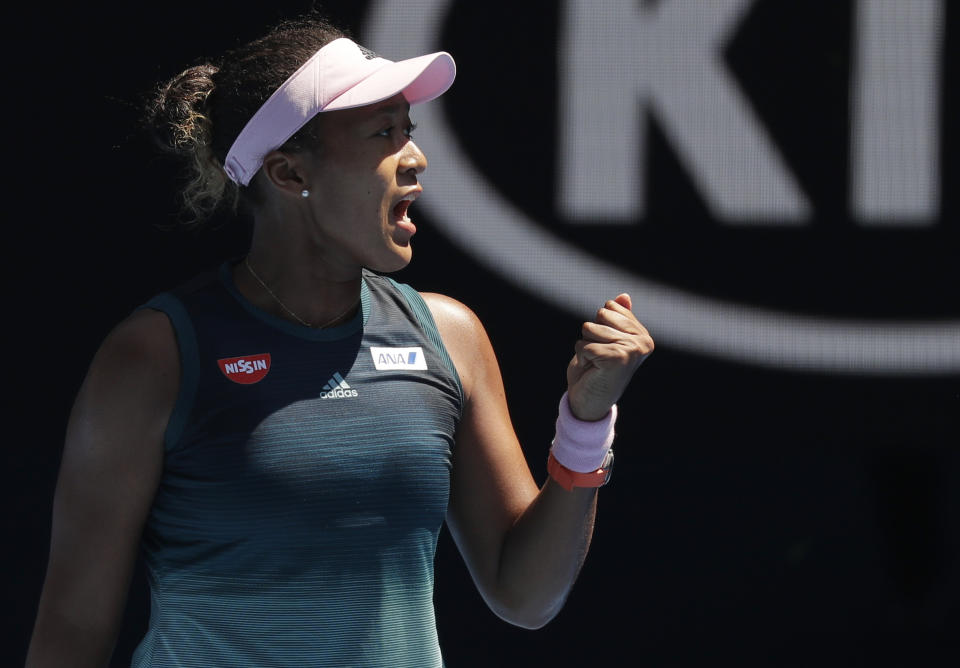 Japan's Naomi Osaka reacts after winning the first set against Ukraine's Elina Svitolina during their quarterfinal match at the Australian Open tennis championships in Melbourne, Australia, Wednesday, Jan. 23, 2019. (AP Photo/Kin Cheung)