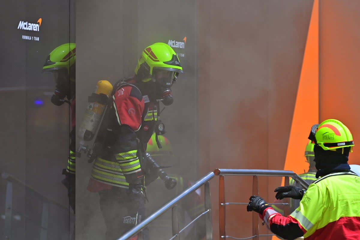 Emergency services tackle a fire at McLaren’s hospitality suite at the Spanish Grand Prix (AFP via Getty Images)