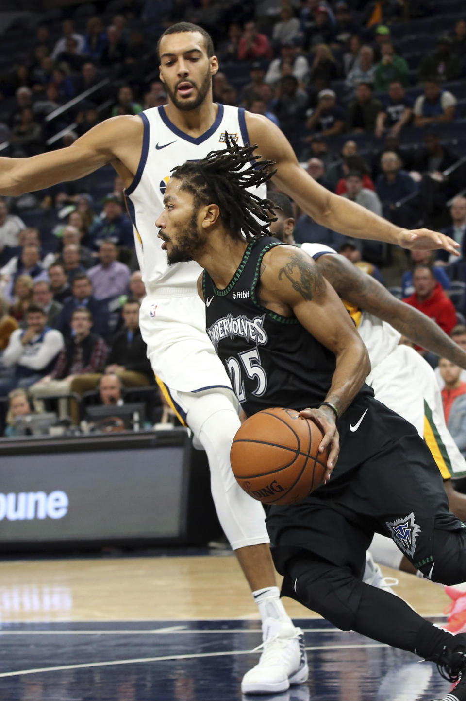 Minnesota Timberwolves' Derrick Rose drives around Utah Jazz's Rudy Gobert during the second half of an NBA basketball game Wednesday, Oct. 31, 2018, in Minneapolis. Rose led the Timberwolves with 50 points, a career high, in the Timberwolves' 128-125 win. (AP Photo/Jim Mone)
