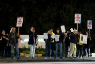 Boeing workers picket after union members voted overwhelmingly to reject a contract offer and go on strike Friday, Sept. 13, 2024, outside the company's factory in Renton, Wash. (AP Photo/Lindsey Wasson)