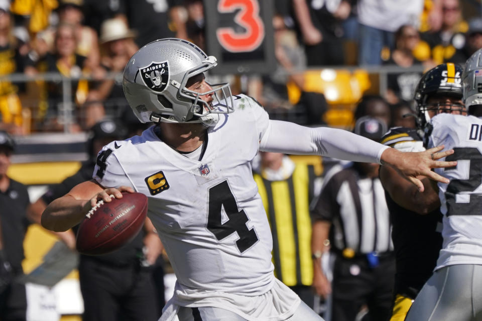 Las Vegas Raiders quarterback Derek Carr (4) throws a touchdown pass to wide receiver Henry Ruggs III during the second half of an NFL football game against the Pittsburgh Steelers in Pittsburgh, Sunday, Sept. 19, 2021. (AP Photo/Keith Srakocic)