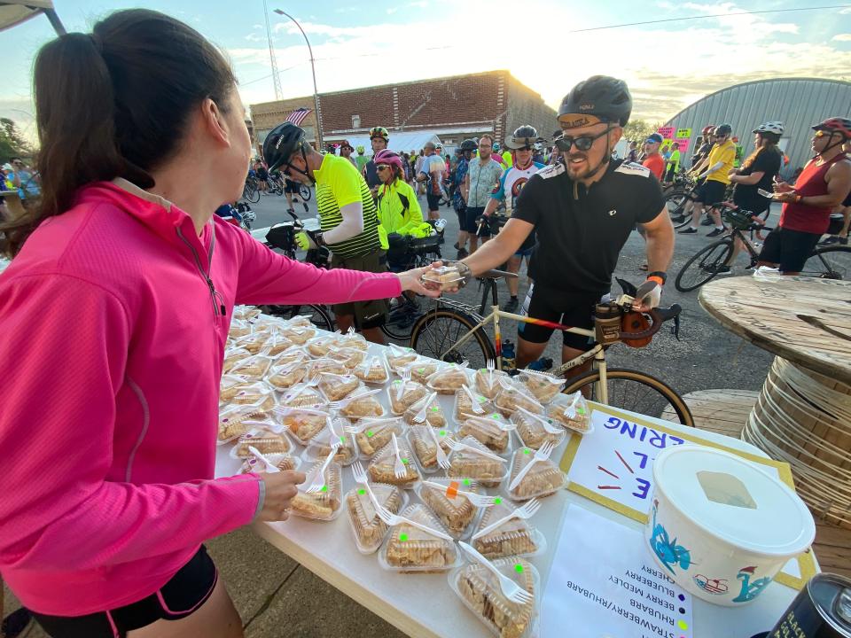 Toby Knott of Omaha, Nebraska, gets a slice of pie from Heavenly Pies in Havelock on the third day of RAGBRAI Tuesday.