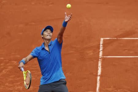 Tennis - French Open - Roland Garros - Novak Djokovic of Serbia vs Yen-Hsun Lu of Taiwan - Paris, France - 24/05/16. Yen-Hsun Lu serves the ball. REUTERS/Benoit Tessier