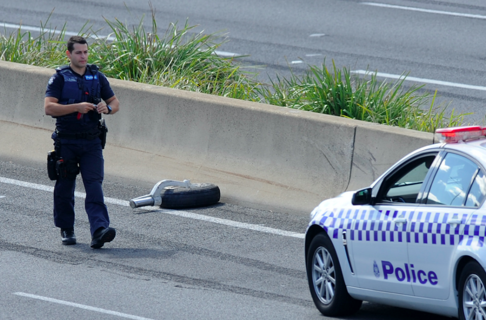 What appears to be one of the wheels from the plane came to rest on the roadway. Photo: AAP