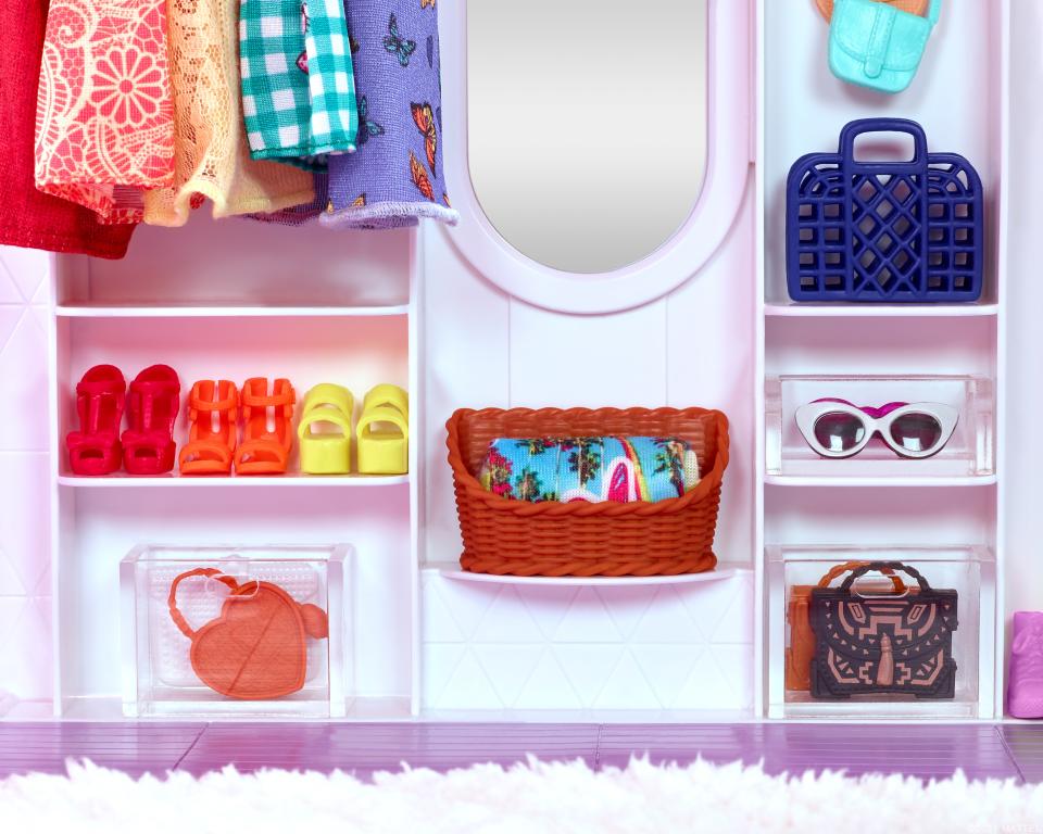 Clear plastic bins to help keep Barbie's accessories organized.