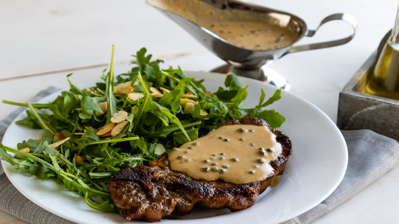 Steak with green peppercorn sauce