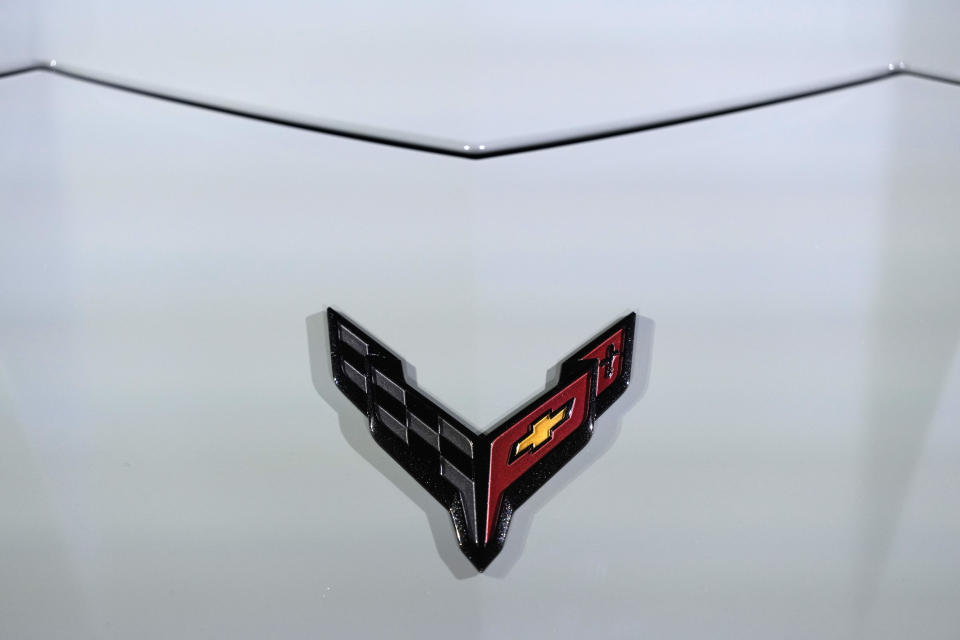 The 2024 Corvette E Ray front logo is displayed, Thursday, Jan. 12, 2023, in Milford Mich. The fastest corvette ever made comes out next year, and it's not powered soley by the traditional howling V8. The E Ray is a gas electric hybrid, the first all wheel drive version of the storied sports car with the front wheels running on a battery. Aimed at affluent buyers who want new technology in the top-line Chevrolet sports car, the $104,000 E Ray jerks your head back as it goes from zero to 60 mph in 2.5 seconds. (AP Photo/Carlos Osorio)