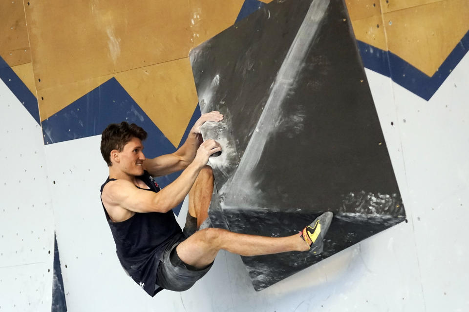 FILE - United States' Nathaniel Coleman climbs during the men's boulder qualifications at the climbing World Cup on May 21, 2021, in Salt Lake City. Sport climbing's popularity has risen in recent years as more climbers have turned out to scale walls indoor and out. (AP Photo/Rick Bowmer, File)