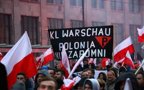 Anti-abortion activists joined the march through the center of Warsaw - Credit: Jakob Ratz/Pacific Press