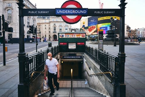 <span class="caption">Piccadilly Circus subway underground station is emptier than usual.</span> <span class="attribution"><a class="link " href="https://www.shutterstock.com/image-photo/london-uk-april-11th-2020-man-1700563906" rel="nofollow noopener" target="_blank" data-ylk="slk:Matteo Roma/Shutterstock;elm:context_link;itc:0;sec:content-canvas">Matteo Roma/Shutterstock</a></span>