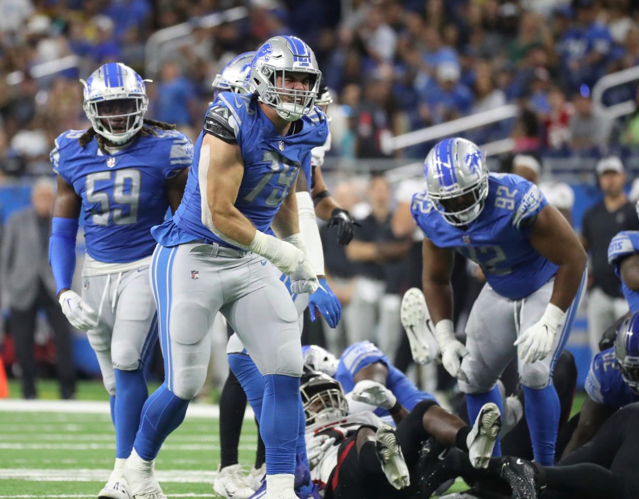 Lions defensive end John Cominsky celebrates after making a tackle against the Falcons during the second half of the Lions' 27-23 preseason loss to the Falcons on Friday, Aug. 12, 2022 at Ford Field.