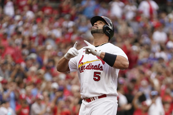 St. Louis Cardinals' Albert Pujols celebrates after hitting a two-run home run during the eighth inning of a baseball game against the Chicago Cubs Sunday, Sept. 4, 2022, in St. Louis. (AP Photo/Jeff Roberson)