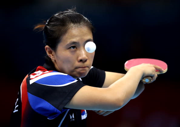 LONDON, ENGLAND - AUGUST 06: Kyungah Kim of Korea in action against Ning Ding of China during the women's team table tennis semifinals on Day 10 of the London 2012 Olympic Games at ExCeL on August 6, 2012 in London, England. (Photo by Ezra Shaw/Getty Images)