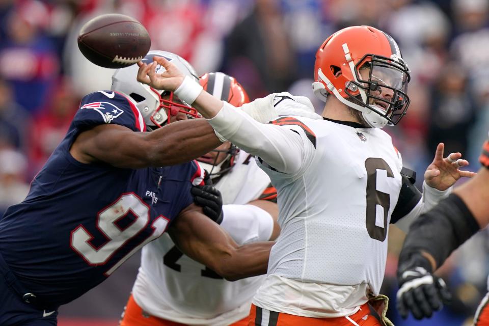 New England Patriots defensive end Deatrich Wise (91) forces Cleveland Browns quarterback Baker Mayfield (6) to fumble during the first half of an NFL football game, Sunday, Nov. 14, 2021, in Foxborough, Mass. (AP Photo/Steven Senne)