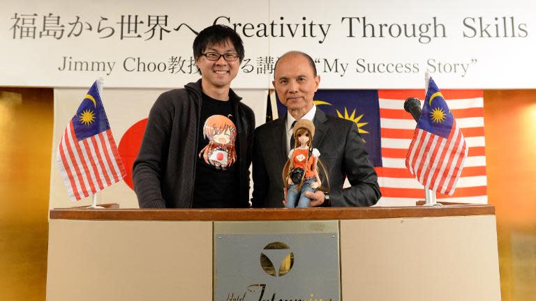 Jimmy Choo (right) with his son, Danny Choo after his lecture "Creativity Through Skills" in Fukushima city on April 18, 2014