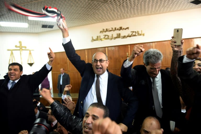 Egyptian lawyer and former presidential candidate Khaled Ali (centre) celebrates after the High Administrative Court on January 16 upheld a ruling voiding an accord to hand over two Red Sea islands to Saudi Arabia