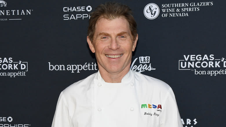 Bobby Flay smiling at event