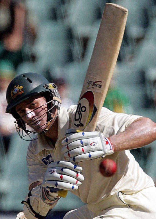 File photo shows Australian batsman Mike Hussey playing a shot bowled by South Africa's Jacques Kallis during a Test match at Wanderers stadium in Johannesburg on April 3, 2006. Hussey has announced he will retire from Test cricket after next week's third and final match against Sri Lanka in Sydney