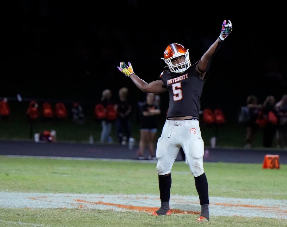 University's Jaay-r Cook Jr celebrates a turnover during a game with Spruce Creek at University High School in Orange City, Friday, Oct. 13, 2023.