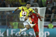 <p>Radamel Falcao vies for a ball with Ashley Young </p>
