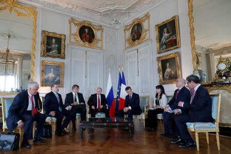 French President Emmanuel Macron (4rdR) and Russian President Vladimir Putin (4thL) meet for talks at the Chateau de Versailles before the opening of an exhibition marking 300 years of diplomatic ties between the two countries in Versailles, France, May 29, 2017. REUTERS/Philippe Wojazer